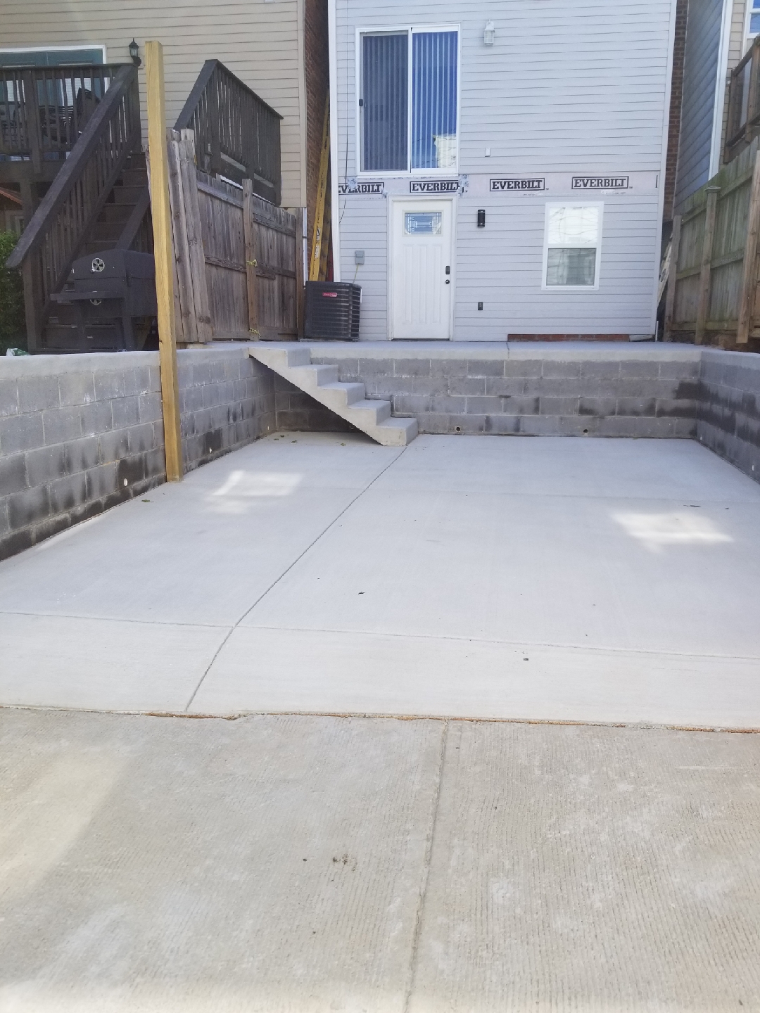 Concrete patio and block retaining walls